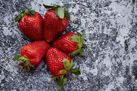 top view five strawberry on gray backgroundの写真素材