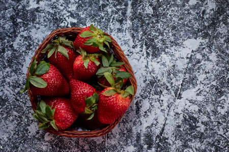 top view strawberry basket on gray background