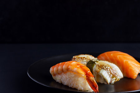Sushi set on black background, traditional Japanese foodの写真素材