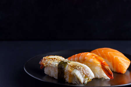 Japanese seafood on dark background.の写真素材