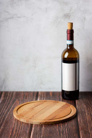 Wine bottles on wooden background. Space for textの写真素材