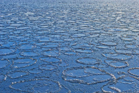 Ice circles on the sea in winterの写真素材