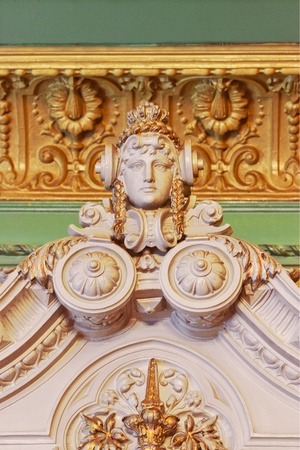 Woman's head. Vintage decorative detail on the wall.の写真素材