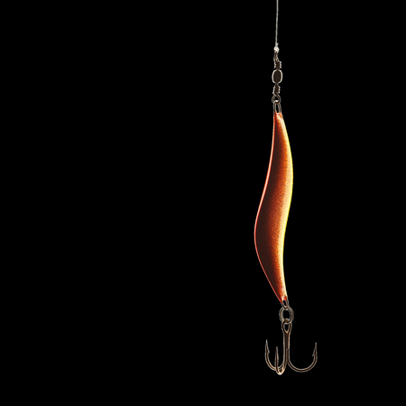 Fishing lure isolated on black with clipping pathの写真素材