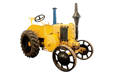Vintage tractor from the 1930-s isolated on whiteの写真素材