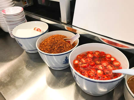 Close up view of condiment in a food court in Thailand