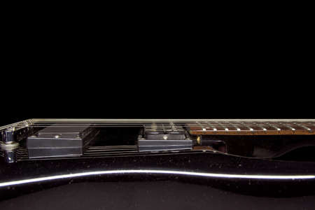 Electric guitar on a black background.の写真素材