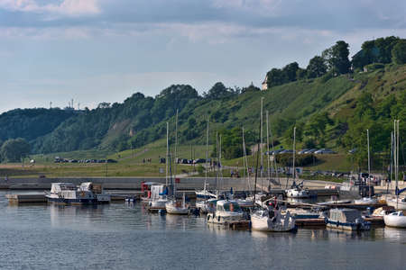Boats moored at the marina on the river. River port with yachts.