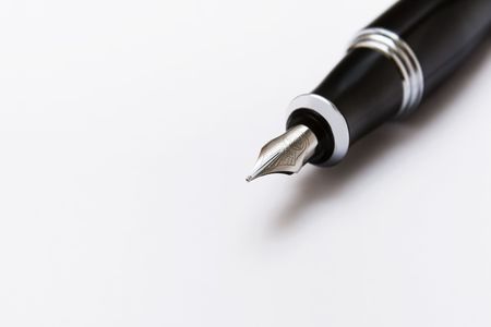 Black pen on a white paperの写真素材