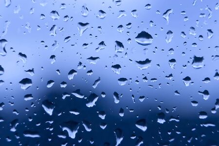 Closeup of water drops on wet glassの写真素材