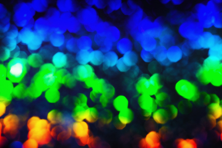 Bokeh glittering shine bulbs lights background:blur of Christmas wallpaper decorations concept.holiday festival backdrop:sparkle circle lit celebrations displayの写真素材