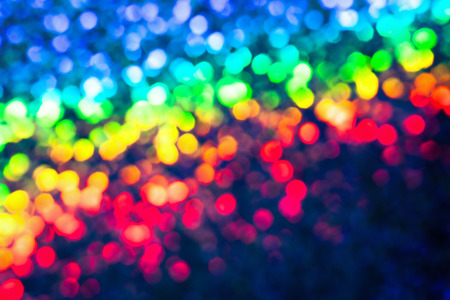 Bokeh glittering shine bulbs lights background:blur of Christmas wallpaper decorations concept.holiday festival backdrop:sparkle circle lit celebrations displayの写真素材