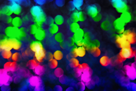 Bokeh glittering shine bulbs lights background:blur of Christmas wallpaper decorations concept.holiday festival backdrop:sparkle circle lit celebrations displayの写真素材