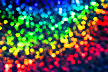 Bokeh glittering shine bulbs lights background:blur of Christmas wallpaper decorations concept.holiday festival backdrop:sparkle circle lit celebrations displayの写真素材