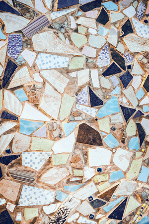 Closeup of neutral colored beige and turquouse abstract mosaic ceramic tiles patterned backgroundの写真素材