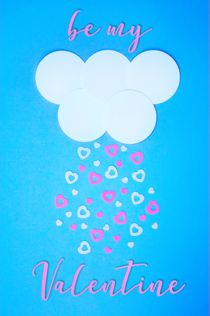 White cloud on pink background with pink and white hearts falling down and lettering Be My Valentine.Trendy simple paper cut Valentine's day template for invitations, greeting cards, posters, blogsの写真素材