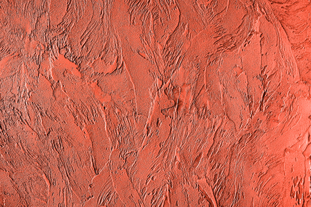 Trendy living coral colored textured background for concept or productの写真素材