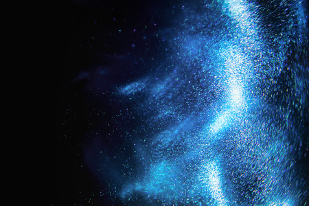 Abstract dark blue and emerald glitter shimmering magic underwater space background. de-focusedの写真素材