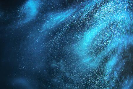 Abstract dark blue and emerald glitter shimmering magic underwater space background. de-focusedの写真素材