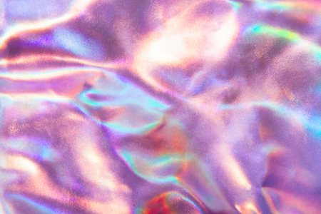 Abstract trendy holographic background in 80s style. Real texture in violet, pink and mint colors with scratches and irregularities. Synthwave. Vaporwave style. Retrowave, retro futurism, webpunkの写真素材