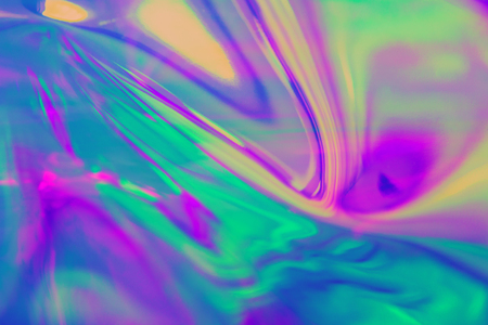 Abstract trendy holographic background in 80s style. Real texture in violet, pink and mint colors with scratches and irregularities. Synthwave. Vaporwave style. Retrowave, retro futurism, webpunkの写真素材