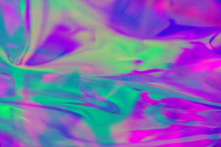 Abstract trendy holographic background in 80s style. Real texture in violet, pink and mint colors with scratches and irregularities. Synthwave. Vaporwave style. Retrowave, retro futurism, webpunkの写真素材