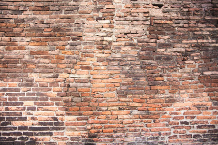 Closeup of old grey and red rough brick wall. For pattern, texture and backgroundの写真素材