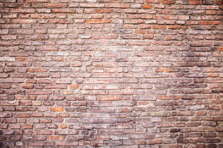Closeup of old grey and red rough brick wall. For pattern, texture and backgroundの写真素材