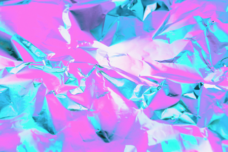 Abstract trendy holographic background in bright pink, violet and mint colorsの写真素材