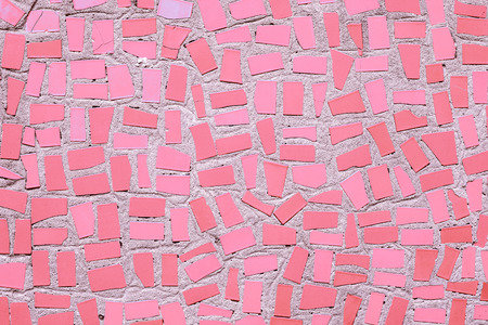 Closeup of pink coloured abstract mosaic ceramic tiles patterned backgroundの写真素材