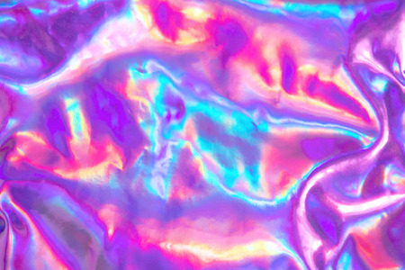 Abstract trendy holographic background. Real texture in violet, pink and mint colors with scratches and irregularitiesの写真素材