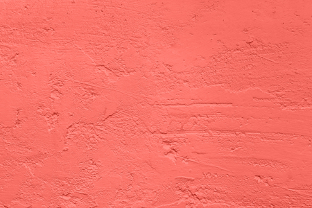 Trendy coral colored Concrete textured background with roughness and irregularities to your concept...