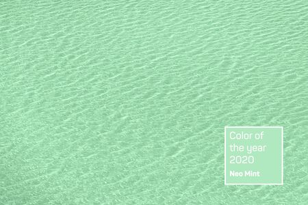 Calm river water surface with water splashes in mint color. Ideal river, sea and ocean texture....