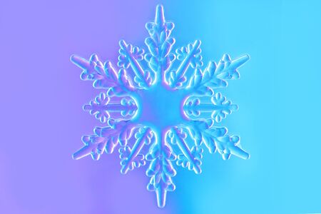 Clear glass snowflake in neon light on gradient purple and blue background. Minimal christmas...