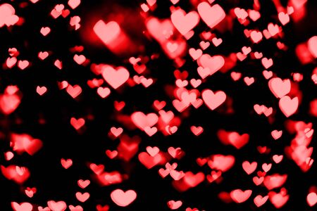 Festive overlay effect. Red and pink heart bokeh festive glitter background. Christmas, New Year and...