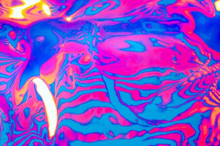 Abstract trendy neon colored psychedelic fluorescent striped zebra textured neon background