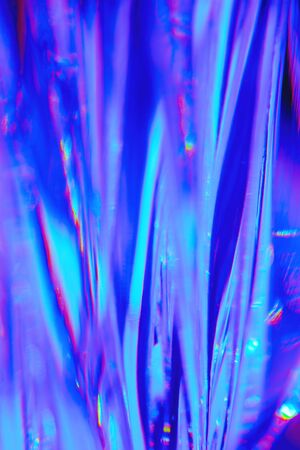Abstract blurred soft focused futuristic wavy background. Trendy neon holographic mint, purple, pink and blue colorsの写真素材
