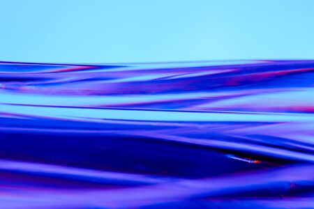 Abstract blurred soft focused futuristic wavy background. Trendy neon holographic mint, purple, pink...