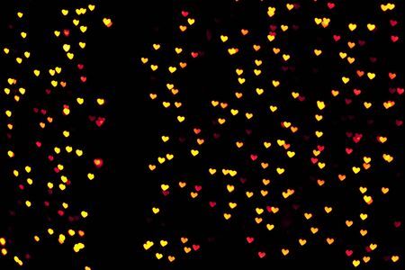 Festive overlay effect. Golden heart bokeh festive glitter background. Christmas, New Year, Valentine's day any other any purposes design.の写真素材