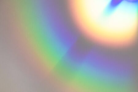 Blurred rainbow light refraction texture overlay effect for photo and mockups. Organic drop diagonal...