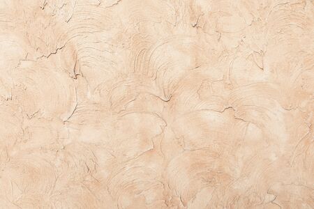 Beige low contrast smooth decorative plaster concrete textured background. Abstract soft neutral...