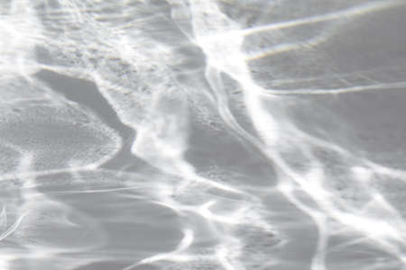 shadow and light caustic effect on a white wall