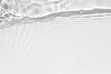 desaturated transparent clear calm water surface textureの写真素材