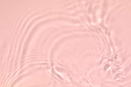 pink transparent clear water surface texture summer backgroundの写真素材