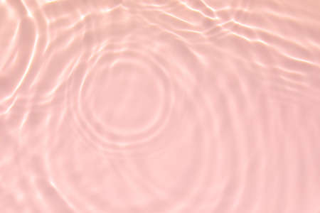 pink transparent clear water surface texture summer backgroundの写真素材