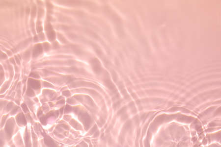 pink transparent clear water surface texture summer backgroundの写真素材