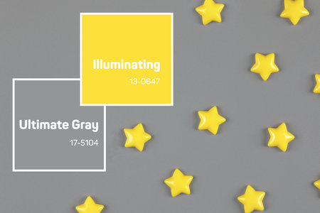 Yellow decorative stars sparse on grayの写真素材