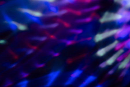 colorful neon light leaks on black backgroundの写真素材