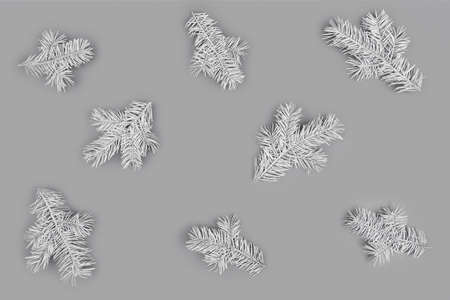 Christmas pattern made of light gray fir branches on gray background