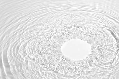 transparent white colored clear calm water surface textureの写真素材
